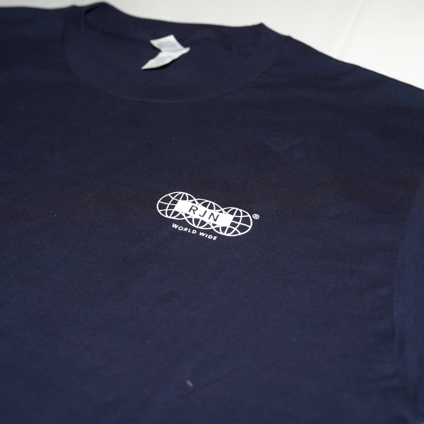 Navy blue sweatshirt with a white logo on a white background